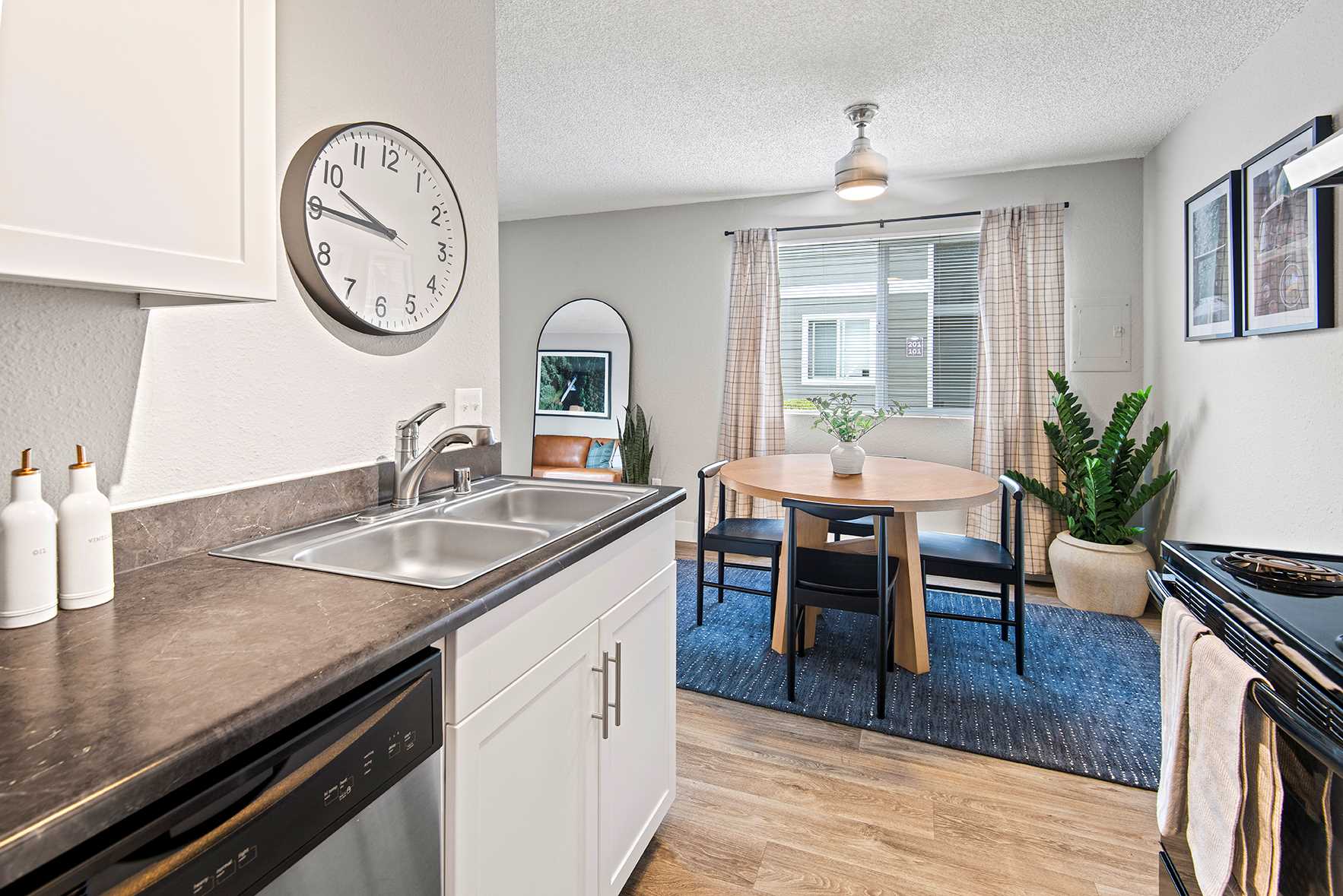 Open kitchen with dining room at Irwin Park Kent, WA apartments